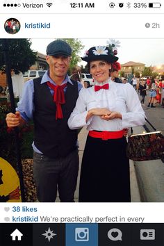 a man and woman dressed up in costume standing next to each other on the street