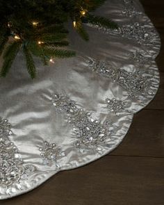 a christmas tree skirt with lights on it