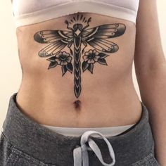 a woman with a tattoo on her stomach