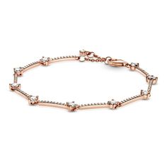 Level up your look with the Pandora Sparkling Pave Bars Bracelet. Hand-finished in 14k rose gold-plated unique metal blend, this design is inspired by a piece from Pandora's archive. Featuring rigid bars decorated with smaller clear stones set between larger ones, this bracelet includes a lobster clasp closure with a stone dangle tag at the end. Adjustable in size, offset the warm tones of this bracelet with bangles in sterling silver. This bracelet is 6.3 inches in length. Pandora Style #: 5892 Pandora Rose, Pandora Style, Bar Bracelets, Pandora Bracelets, Pandora Bracelet, Pandora Jewelry, Stone Settings, Pure Silver, Level Up