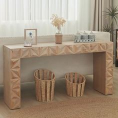 a wooden table with two baskets on it