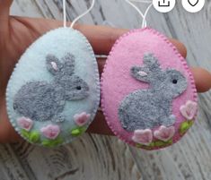 two felt easter bunnies with rabbits on them