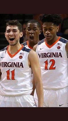 three men in white uniforms standing next to each other with their mouths open and laughing