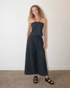 The raf pant features an elastic drawstring waistband an extra wide leg and a long crotch seam.    100% linen    relaxed fit.    model is 5'10" and is wearing size small.    made in mexico.    size xs: waist 24″| hip 40″| rise 14″| sideseam 37.8″    size s: waist 25″ | hip 42″ | rise 14″ | sideseam 37.8″    size m: waist 26″ | hip 44″ | rise 14″| sideseam 37.8″    size l: waist 27″ | hip 46″ | rise 14″| sideseam 37.8″    machine or hand wash cold and dry flat. Chic Linen Wide Leg Pants With Drawstring, Spring Linen Wide Leg Pants With Drawstring, Celine Top, Silk Noil, Mood Indigo, Ace And Jig, Drawstring Waistband, Black Crop Tops, Boutique Dresses