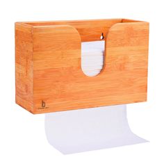 a roll of toilet paper sitting on top of a wooden box