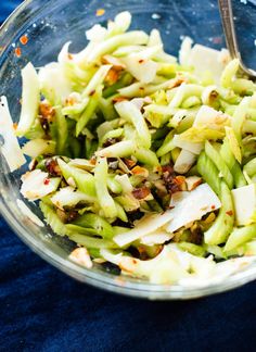 a glass bowl filled with chopped up vegetables