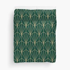 a green and gold art deco pattern duvet cover with white pillow shampoos