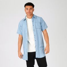 "Introducing our Slim Fit Longline Short Sleeve Denim Shirt in a fashionable Light Blue Wash! Crafted for the modern trendsetter, this shirt seamlessly combines sleek style with ultimate comfort. Made from premium denim fabric, its slim fit and longline design flatter your frame while providing a contemporary edge. The short sleeves add a casual twist, making it perfect for warm or breezy days. Whether you dress it up with chinos or down with jeans, this versatile denim shirt is a wardrobe essential for any fashion-forward individual. Stand out from the crowd and make a stylish statement with our Slim Fit Longline Short Sleeve Denim Shirt Light Blue Wash! Product Features: Light blue wash Denim fabric Slim fit Longline styling Button front fastening Chest pocket Contrast stitch Half Sleeve Relaxed Fit Chambray Shirt With Short Sleeves, Casual Short Sleeve Chambray Shirt, Light Blue Denim Shirt With Short Sleeves, Relaxed Fit Short Sleeve Chambray Shirt, Denim Short Sleeve Shirt For Streetwear, Light Wash Cotton Shirt For Streetwear, Light Blue Denim Short Sleeve Shirt, Casual Slim Fit Washed Blue Shirt, Short Sleeve Denim Shirt For Streetwear