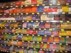 a display in a grocery store filled with lots of different types of snacks and drinks