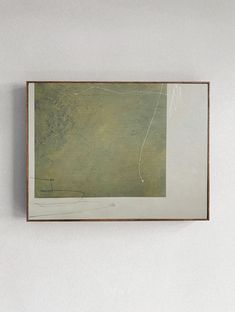 an abstract painting hangs on the wall