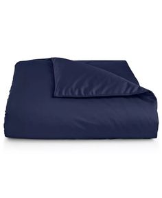 an image of a blue comforter set on a white background with the cover pulled down