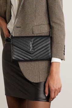 SAINT LAURENT's 'Monogramme' shoulder bag has been made in Italy from quilted textured-leather and punctuated with the brand's iconic 'YSL' plaque. It's fitted with a zipped compartment and 20 card slots so you can forgo a wallet. Detach the chain strap to carry it as a clutch.  Wear it with: [SAINT LAURENT Blazer id1265071], [The Row Skirt id1009790], [SAINT LAURENT Shirt id1109774], [SAINT LAURENT Pumps id1265621]. Ysl Wallet On Chain, Saint Laurent Blazer, Saint Laurent Pumps, Saint Laurent Shirt, Winter Wardrobe Essentials, Saint Laurent Handbags, Yves Saint Laurent Bags, Duffle Bag Travel, Designer Crossbody Bags