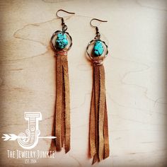 Turquoise beads mix with genuine suede leather to create a great boho look! Pair with the matching necklaces and bracelets. Approx. Length: 5" Although your item will resemble the photo, each piece is created by hand, so no two are identical.Thank you for visiting The Jewelry Junkie! Country Turquoise Jewelry, Suede Crafts, Leather And Turquoise Jewelry, Leather Tassel Earrings, On A Cord Jewelry Hobby Lobby, Adjustable Turquoise Leather Jewelry, How To Make Leather Earrings, Diy Boho Earrings, Western Leather Earrings