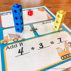 a close up of a board game on a table with blocks and dices in it