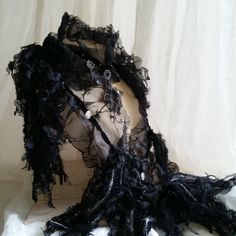 "Beautiful and elegant hand sewn Raven Skull Pendant, Gothic, Renaissance, Steampunk, inspired black velvet trim, organza choker scarf boa  A lot of work, patience and time went into creating this wearable art piece & it will be difficult to let go. Beautiful fire sculpted black organza looks like black lace as it wraps & drapes high around neck with a unique winged pewter looking Raven Skull pendant. Various strand textures add a soft, flowing & whispy effect.  Wear to accessorize as a Gothic w Halloween Choker, Choker Scarf, Plain Black Tee, Raven Skull, Led Fashion, Velvet Pumpkins, Bird Skull, Gothic Steampunk, Gothic Halloween