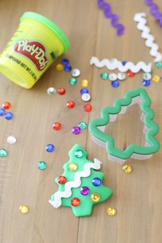 the cookie cutters are laying on the table with confetti and other decorations