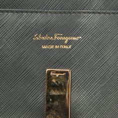 description: This Salvatore Ferragamo wallet is an example of the brand's fine designs that are skillfully crafted to project a classic charm. It is a functional creation with an elevating appeal.gender: Women.includes: The Luxury Closet Packaging.Exterior Material: Leather.Length: 19 cm.Width: 2.5 cm.Height: 10 cm.Hardware: Gold Tone.Interior Material: Leather and Nylon.Origin: Italy.Condition:.Fair.Well-maintained with scuffs/white marks in some areas, minor wear on metal. Designer Gold Bifold Wallet, Formal Rectangular Wallet With Coin Pocket, Designer Bifold Wallets For Formal Occasions, Designer Gold Wallets For Business, Formal Clutch Wallet With Coin Pocket, Elegant Leather Wallets With Engraved Logo, Luxury Wallets With Engraved Logo For Everyday Use, Luxury Wallets With Engraved Logo, Gold Rectangular Wallets For Business