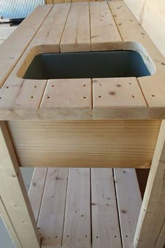 a sink made out of wooden planks in a room