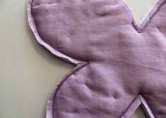 a close up of a piece of cloth with a heart shaped design on the side