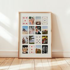 a wooden frame with pictures on it in front of a white wall and hardwood floor