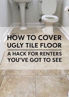 a white toilet sitting next to a sink in a bathroom under a window with the words how to cover ugly tile floor a hack for renters you've got to see