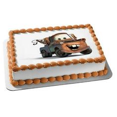 a birthday cake decorated with an image of mater from the disney pixar movie