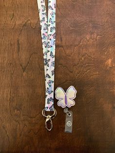 Perfect lanyard for spring and summer. Adorable butterflies with a coordinating badge reel.  Styles to choose from: *Non-Breakaway:  This is a regular lanyard that has a complete loop around your neck. *Breakaway:  This lanyard has a safety "breakaway" piece on the back of the neck.  A tug on the lanyard and the lanyard "breaks away".   *Side Release: This lanyard has a buckle at the bottom of the lanyard so you can easily remove the lower half.  It automatically comes with the breakaway at the Butterfly Lanyard Cute, Lanyard Id Holder, Teacher Lanyard, Rose Gold Hardware, Cotton Quilting Fabric, Id Holder, Badge Holders Lanyard, Multiple Color, Badge Holders