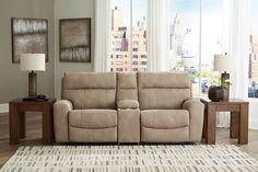 a living room scene with focus on the reclining sofa