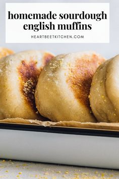 sourdough english muffins lined up in a white enamel baking pan. Sourdough Active Starter Recipes, Sourdough Recipes English Muffins, Sourdough English Muffin Recipe Easy, Fluffy Sourdough English Muffins, Sourdough Starter English Muffins, Homemade Sourdough English Muffins, Same Day Sourdough English Muffins