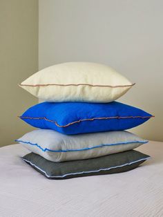 four pillows stacked on top of each other