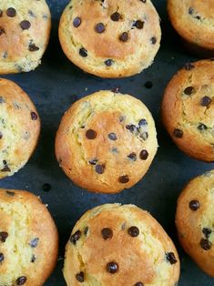 freshly baked chocolate chip muffins on a baking sheet, ready to be eaten