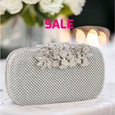 Was $59 Gorgeous, Elegant And Unique, This Silver Clutch, Shoulder Bag Is Covered With Crystals And An Intricate Rhinestone Clasp Design. It Features A Removeable Crossbody Chain. Style As A Clutch Or As A Shoulder Bag! I Have It In Black Too. Black Bag Is Listed Separately. Evening Bag Flower Detail Prom Detachable Chain Strap. Vegan With Lined Interior. Clasp Closure. Gold Toned Hardware. 7.5l X 4h X 2.5w Leather Lavish Glamour 60s 70s 80s 90s Glitzy Modern Spring Summer Fall Winter Cruise Hig Winter Cruise, Bow Clutch, Lounge Party, Silver Clutch, Bag Flower, Crystal Clutch, Party Clutch, Purse Handles, Vintage Clutch