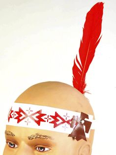 Get ready for your talk with the chief when you slip a Deluxe Indian Headband on! This bright white headband has red patterns and a standing red feather. A brown pleather eagle decorates the side. Goes great with our many Native American costumes. Indian Headband, Halloween Costume Hats, Indian Hat, Red Feather, White Headband, Halloween Accessories, Costume Makeup, Red Pattern, Costume Accessories