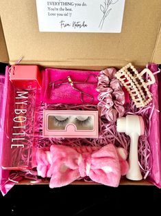 an open box with fake eyelashes and accessories