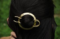 Hair slide with stick from brass with little stars.This item is fully hadcrafted. The circle part is formed and shaped from thick brass sheet and covered with 8 little stars. All the stars are hand-sawed. The stick is made from thick brass wire, hammered, textured and gently polished. You can wear the stick separately as a hair pin or in pair with the circle as a hair slide. The circle outer diameter is about 2.5" (6.5 cm), the length of the stick is about 3.5" (9 cm).This item will be made just Handmade Gold Hair Accessories For Gifts, Space Bun, Hair Cuff, Celestial Stars, Bun Holder, Hair Cuffs, Star Hair, Hair Slide, Wide Band Rings