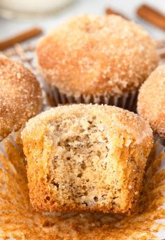 three cinnamon muffins sitting on top of a white plate