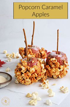 popcorn caramel apples are stacked on top of each other with sticks sticking out of them