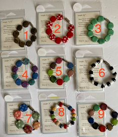 several different bracelets with numbers on them