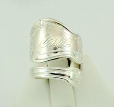 "Real vintage engraved initials \"F W H\" hand made sterling silver adjustable size 7 1/4 spoon ring. A great conversation piece and fun to wear. FREE SHIPPING! Details: Sterling Silver: (shown in picture) Ring Size: 7 1/4 (adjustable) Total Weight: 8.3 grams FREE domestic shipping by USPS delivery mail and includes insurance. If the item is to be shipped internationally Etsy will auto-calculate postage. Please notify us at purchase if you are buying more than one item and we will gladly combine Adjustable Silver Engraved Ring With Hallmarks, Adjustable Sterling Silver Engraved Ring With Hallmarks, Adjustable White Gold Engraved Ring With Stamped Details, Adjustable Hallmarked Engraved Silver Ring, Adjustable Hallmarked Silver Engraved Ring, Jewellers Bench, Resize Ring, Engraved Initials, Spoon Rings