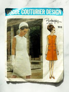 Vogue Couturier Design 1916; ca. 1968; Pertegaz of Spain - Misses' One-Piece Dress. Semi-fitted, A-line sleeveless dress with back button closing has front and back seaming detail round neckline. Flaps with button and buttonhole trim. Topstitch trim. Featured in Vogue Pattern Book April/May 1968 Size 12 Bust 34 Waist 25.5 Hip 36 Envelope is in very good vintage condition with minimal wear. There is very slight wear by the top flap and corners.  Pattern is cut and complete with instructions inclu Straight Skirt Pattern, 60s Vogue, 1960s Vogue, Vogue Dress Patterns, Vintage Vogue Sewing Patterns, Vogue Dress, Vogue Sewing Patterns, Vogue Pattern, 1960s Fashion