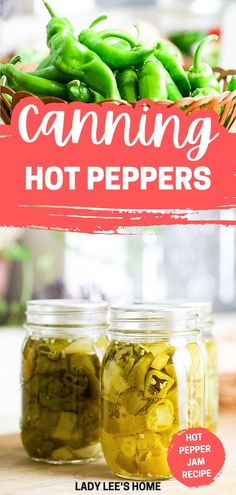 two jars filled with green peppers sitting on top of a wooden table next to a sign that says canning hot peppers