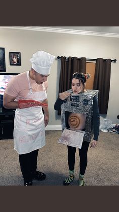 a man and woman dressed up as bakers