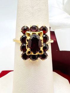 18K Yellow Gold Garnet Ring Size 7 A perfect gift for your loved one for any special occasion or holiday! Total Ring Weight: 4.14g Ring Length: 26.49mm Ring Width: 19.48mm Gemstone: Garnet Item will be placed into a gift box. * Formal Multi-stone Garnet Rings, Luxury Cluster Ruby Ring Gift, Heirloom Cluster Ring Gift, Yellow Gold Garnet Cluster Ring As Gift, Formal Garnet Gemstone Cluster Ring, Luxury Cluster Ring Gift, Formal Yellow Gold Garnet Cluster Ring, Antique Gemstone Cluster Ring As Gift, Antique Cluster Ring With Gemstone For Gift