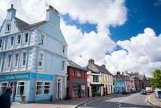 a blue building on the corner of a street