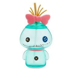 a blue glass vase with a pink bow on it's head and two toothpicks sticking out of the top