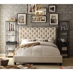 a bedroom with pictures on the wall and a large bed in front of it's headboard