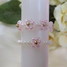 ♡ Handmade beaded daisy rings ♡ Handmade with love, these high-quality elasticated rings are made of dainty & shiny seed beads. This set is a pastel pink, however, it can be customised to the colours on the 4th page if you like! Comes in a small, medium, or large. These are stretchy and adjustable to any size. ✯Packaged with care in a white organza bag ✯ The perfect gift for yourself or a loved one ✯ Items are all slightly unique as they are handmade to order ✯ To keep it in the best condition, Handmade Beaded Rings, Beaded Flower Ring Gift, Beaded Flower Ring With Round Beads As A Gift, Dainty Flower Shaped Jewelry With Spacer Beads, White Beaded Flower Shaped Ring, Gift Flower Ring With Beads, Beaded Flower Ring For Gifting, Beaded Flower Ring For Gift, Beaded Flower Ring As Gift