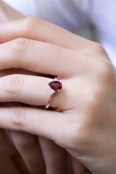 "\"Teardrop Cut Ruby Statement Ring with Diamonds | Red Ruby Gem Elegant Ring | 14k Gold Proposal Ring | Ruby Bride Wedding Ring \" Teardrop Cut Ruby 8k or 14K Solid Gold Ring with Diamonds, Perfect choice for engagement, wedding and statement. 2 diamonds used in the ring with real ruby. I can also make it with Sapphire Gemstone, please check below and contact me for details. https://www.etsy.com/listing/912308754 * Band Material: 8k/14k Solid Gold (Yellow, Rose and White options) * Gemstone: Di Lab-created Ruby Ring With Accent Stones As Gift, Solitaire Pear-shaped Jewelry For Proposal, Red Teardrop Ruby Ring For Gift, 14k Gold Pear-shaped Ruby Ring For Wedding, Teardrop Gemstone Ring For Proposal, Pear-shaped 14k Gold Gemstone Wedding Ring, Trillion Cut Diamond Ring With Accent Stones As Gift, Teardrop Diamond Ring For Gift, Teardrop Yellow Gold Ruby Ring For Wedding