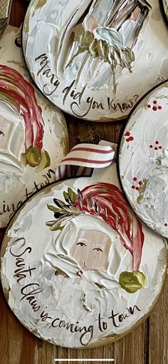 some plates with christmas designs on them sitting on a table