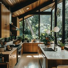 Mid-century modern kitchen connected to nature with indoor plants, natural materials, and elements maximizing views and natural light4 Kitchen Blueprints, Kitchen Midcentury, 70s House, Kitchen Guide, Mid Century Modern Kitchen, Mid Century Modern Interiors, Mid Century Kitchen, Kitchen Trends, Dream House Interior